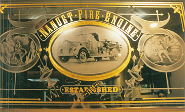 large carved mirror - etched halftone, 23 K inlay with engine turning for firehouse